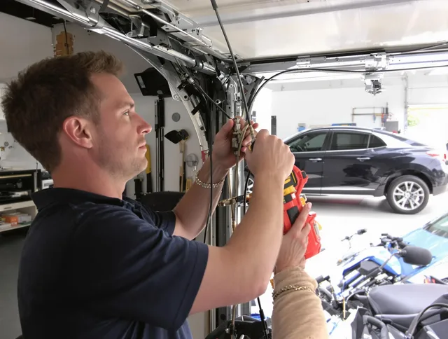 Wilton Garage Door Repair safety certified technician performing cable replacement in Wilton