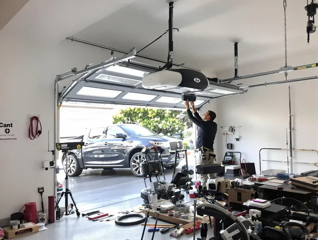 Wilton Garage Door Repair specialist installing smart garage door opener system in Wilton home