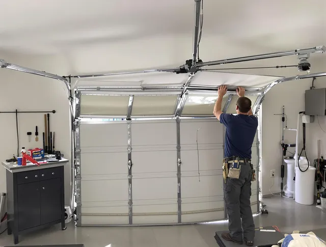 Wilton Garage Door Repair specialist performing precise section replacement on Wilton garage door